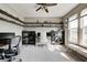Spacious home office with built-in shelving, large windows, and comfortable seating at 5842 Oakmont Blvd, Bargersville, IN 46106