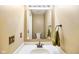 Well-lit powder room with vanity and a clean, minimalist design at 6144 Maple Branch Pl, Indianapolis, IN 46221