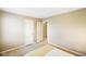 Neutral bedroom featuring carpet, two doors, with a yellow and white striped bedspread at 6144 Maple Branch Pl, Indianapolis, IN 46221