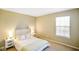 Cozy bedroom featuring a comfortable bed, soft lighting, and a relaxing ambiance at 6144 Maple Branch Pl, Indianapolis, IN 46221