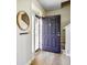 Inviting foyer with hardwood floors, coat hooks, and plenty of natural light at 6144 Maple Branch Pl, Indianapolis, IN 46221