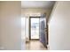 Open foyer with hardwood floors leading to a staircase and view of the front yard at 6144 Maple Branch Pl, Indianapolis, IN 46221