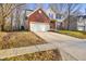This two-story home features a brick facade and an attached two-car garage at 6144 Maple Branch Pl, Indianapolis, IN 46221