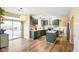 Modern kitchen with stainless appliances, an island, and access to outdoor space through a glass door at 6144 Maple Branch Pl, Indianapolis, IN 46221