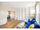 Bright living room boasts built-in shelving, wood floors, and large window providing natural light at 6144 Maple Branch Pl, Indianapolis, IN 46221