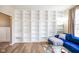 Light-filled living room featuring a large built-in bookcase and stylish, comfortable seating area at 6144 Maple Branch Pl, Indianapolis, IN 46221