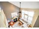Open living room featuring a fireplace, fan and large windows for ample light at 6144 Maple Branch Pl, Indianapolis, IN 46221