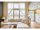 Cozy living room featuring a large sofa, natural light, and a serene atmosphere at 6144 Maple Branch Pl, Indianapolis, IN 46221