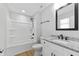 Bathroom with shower and tub combo and modern granite vanity at 617 W 39Th St, Indianapolis, IN 46208