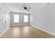 Bedroom with light wood flooring, neutral walls, and a ceiling fan at 617 W 39Th St, Indianapolis, IN 46208