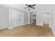 Spacious bedroom with wood floors, ceiling fan, and large closets at 617 W 39Th St, Indianapolis, IN 46208