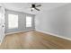 Bedroom boasts lots of natural light, neutral paint, and wood floors at 617 W 39Th St, Indianapolis, IN 46208