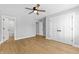 Primary bedroom features include neutral paint, ceiling fan, and wood flooring at 617 W 39Th St, Indianapolis, IN 46208
