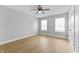 Bright bedroom featuring light wood floors, neutral walls, and a ceiling fan at 617 W 39Th St, Indianapolis, IN 46208