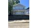 New construction two-story home with gray siding, white trim, and large windows at 617 W 39Th St, Indianapolis, IN 46208