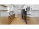 Modern kitchen with stainless steel appliances, granite countertops, and sleek cabinets at 617 W 39Th St, Indianapolis, IN 46208