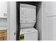 Modern laundry area featuring a stacked white washer and dryer at 617 W 39Th St, Indianapolis, IN 46208