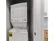 Conveniently located laundry room featuring a stacked washer and dryer at 617 W 39Th St, Indianapolis, IN 46208