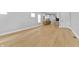 Open-concept living room with new wood flooring and neutral walls at 617 W 39Th St, Indianapolis, IN 46208
