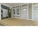 Spacious porch with a wood deck and gray house exterior at 617 W 39Th St, Indianapolis, IN 46208