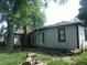 A backyard featuring french doors with an oversized brick chimney at 618 S Tibbs Ave, Indianapolis, IN 46241
