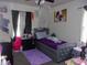 A bedroom boasting a silver studded bedframe and purple accents at 618 S Tibbs Ave, Indianapolis, IN 46241