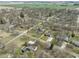 Aerial view showing property boundary, mature trees, and green spaces within a quiet residential neighborhood at 6201 S Carroll Rd, Indianapolis, IN 46259