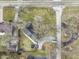 Bird's eye view of a home with a long driveway, small yard, and a trampoline in the backyard at 6201 S Carroll Rd, Indianapolis, IN 46259