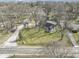 Aerial view of a well-maintained home featuring mature trees and a spacious yard in a tranquil neighborhood at 6201 S Carroll Rd, Indianapolis, IN 46259