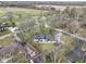 Aerial shot highlighting a property with ample yard space, mature trees, and a cozy backyard patio at 6201 S Carroll Rd, Indianapolis, IN 46259