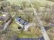 Aerial view showcasing property with circular trampoline and a nearby storage area in a residential neighborhood at 6201 S Carroll Rd, Indianapolis, IN 46259