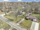 Aerial view of a home and surrounding neighborhood showcasing mature trees and proximity to other residences at 6201 S Carroll Rd, Indianapolis, IN 46259