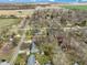 Aerial view showing property line in a quiet neighborhood with mature trees and surrounding agricultural land at 6201 S Carroll Rd, Indianapolis, IN 46259
