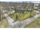Aerial view of a charming home with well-manicured lawn and mature trees in a quiet neighborhood at 6201 S Carroll Rd, Indianapolis, IN 46259