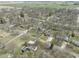 Aerial view showcasing neighborhood with mature trees and green spaces, and proximity to agricultural fields at 6201 S Carroll Rd, Indianapolis, IN 46259
