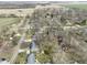 Aerial view of a neighborhood with mature trees, spacious yards, and surrounding agricultural landscape at 6201 S Carroll Rd, Indianapolis, IN 46259