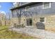 Backyard patio with outdoor dining set, grill and stone accents for entertaining and relaxing at 6201 S Carroll Rd, Indianapolis, IN 46259