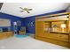 This bedroom has blue accent wall with themed decor, a cozy chair, and a wooden bunk bed at 6201 S Carroll Rd, Indianapolis, IN 46259