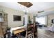 Cozy dining room with a large wooden table, decorative chandelier, and easy access to other living spaces at 6201 S Carroll Rd, Indianapolis, IN 46259