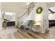 Inviting foyer with hardwood floors, staircase, and views into the spacious living areas at 6201 S Carroll Rd, Indianapolis, IN 46259