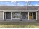 Inviting front porch with rocking chairs, perfect for enjoying quiet moments outdoors at 6201 S Carroll Rd, Indianapolis, IN 46259