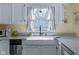 Close-up of a stylish kitchen sink with a window view and ample counter space at 6201 S Carroll Rd, Indianapolis, IN 46259