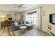 Inviting living room with abundant natural light, a plush sectional, and stylish decor, creating a cozy atmosphere at 6201 S Carroll Rd, Indianapolis, IN 46259