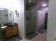 Bathroom featuring a shower, stylish granite countertops, and modern vanity offers a refreshing space at 6651 Sonesta Dr, Indianapolis, IN 46217