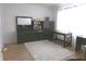 Bedroom featuring a large dresser, a desk, and a fluffy white rug at 6651 Sonesta Dr, Indianapolis, IN 46217