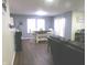 Open-concept dining area with a table and chairs by the window at 6651 Sonesta Dr, Indianapolis, IN 46217