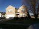 Home exterior with a brick facade, attached garage, and manicured landscaping at 6651 Sonesta Dr, Indianapolis, IN 46217