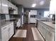 Modern kitchen with stainless appliances, granite countertops, and white cabinets for ample storage at 6651 Sonesta Dr, Indianapolis, IN 46217