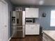 Updated kitchen featuring stainless steel appliances and stylish white cabinets offer a sleek design at 6651 Sonesta Dr, Indianapolis, IN 46217