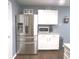Stainless steel refrigerator with white cabinets and a microwave on the counter at 6651 Sonesta Dr, Indianapolis, IN 46217